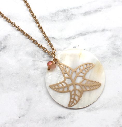 A photo of the Starfish On A Shell Necklace product