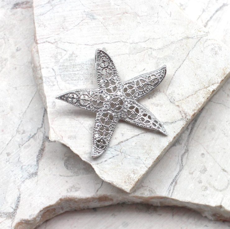 A photo of the The Glitz Starfish Pendant product