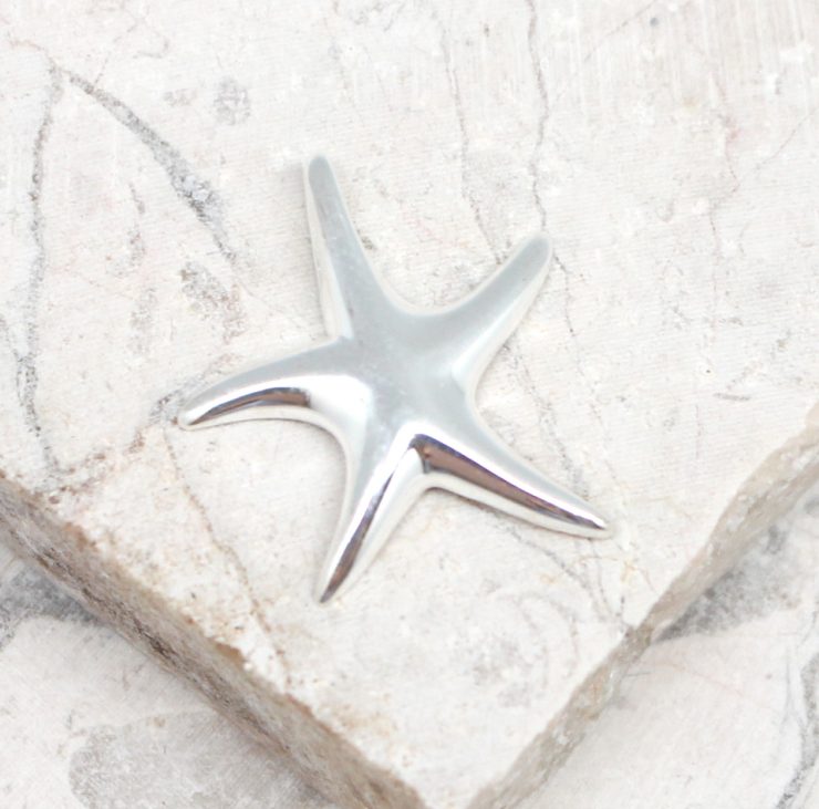A photo of the The Simple Starfish Pendant product