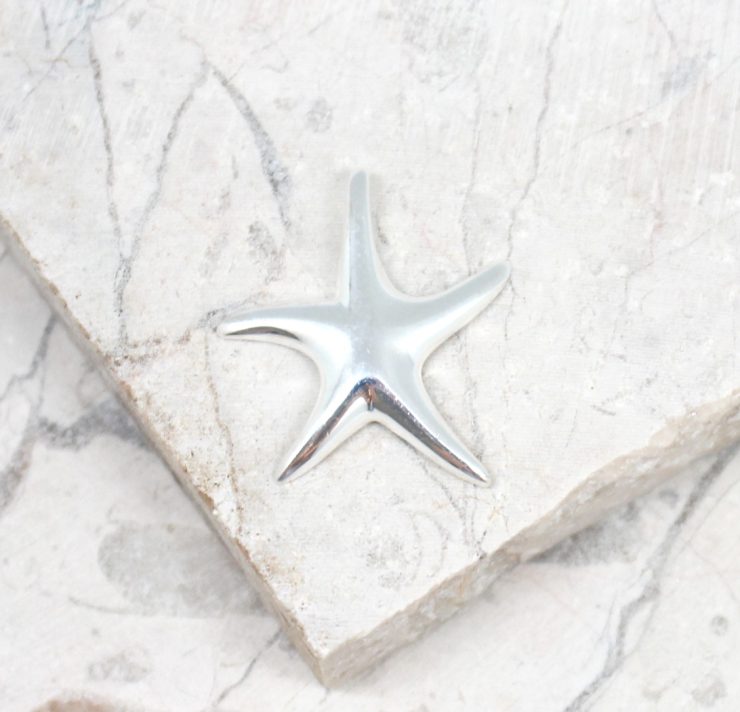 A photo of the The Simple Starfish Pendant product