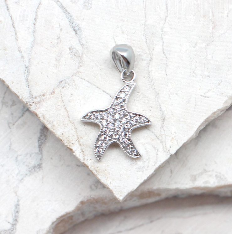 A photo of the The Tiny Rhinestone Sea Star Pendant product