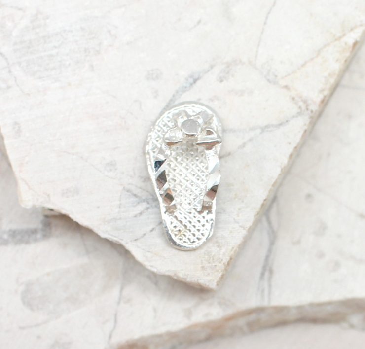 A photo of the The Chiseled Sandal Pendant product