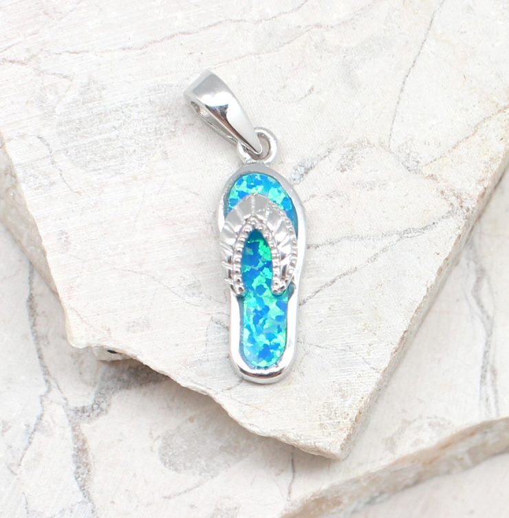 A photo of the The Opal Sandal Pendant product
