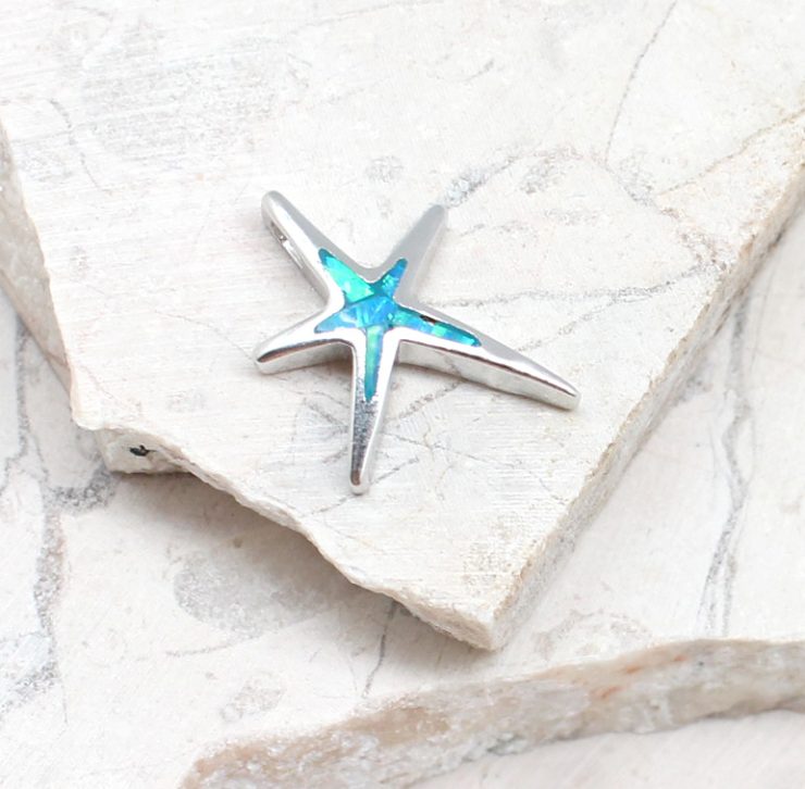 A photo of the The Opal Starfish Pendant product