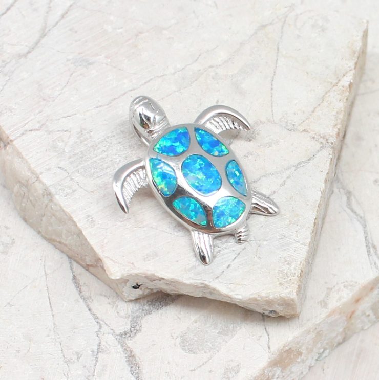 A photo of the The Opal Turtle Pendant product