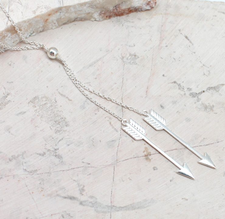 A photo of the Double Arrow Necklace product