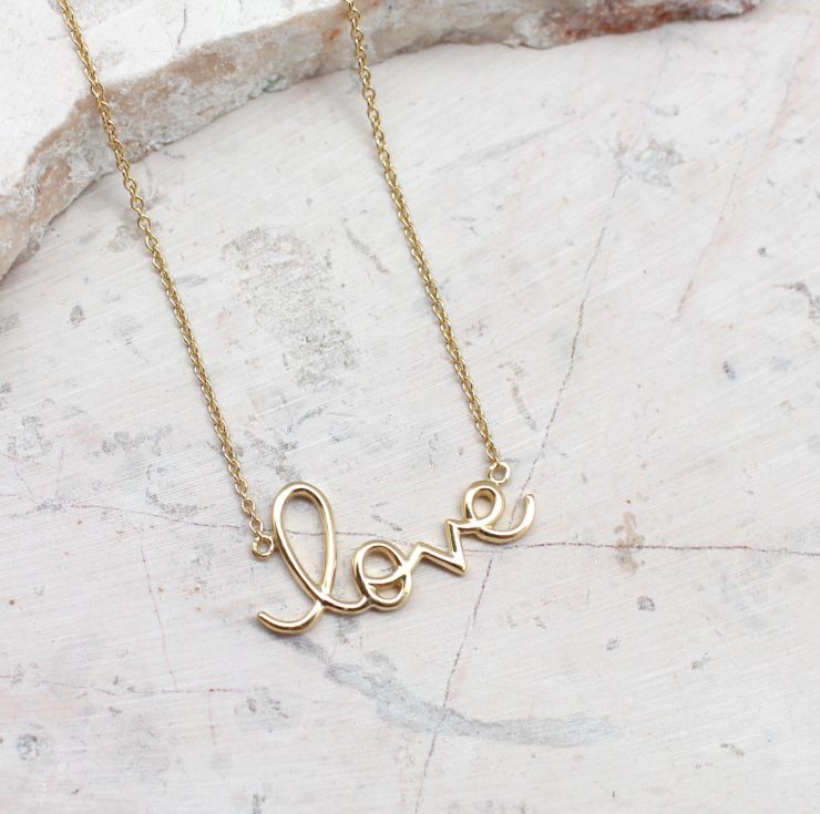 A photo of the Golden Love Necklace product