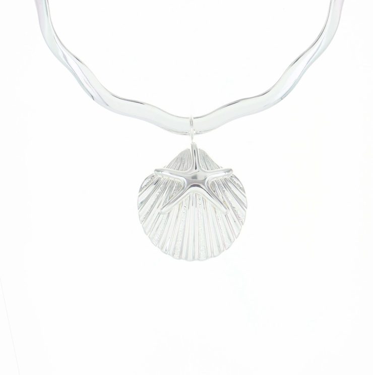 A photo of the Starfish Over Shell Pendant product