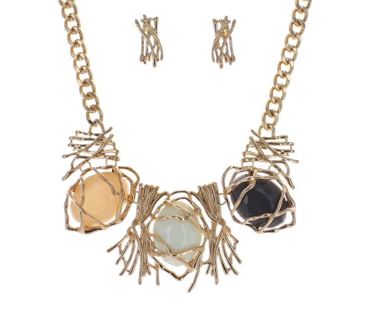A photo of the Golden Web Statement Necklace product