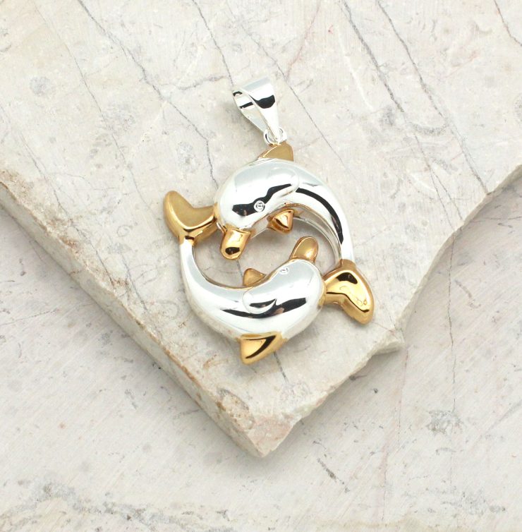 A photo of the Friendly Dolphins Pendant product