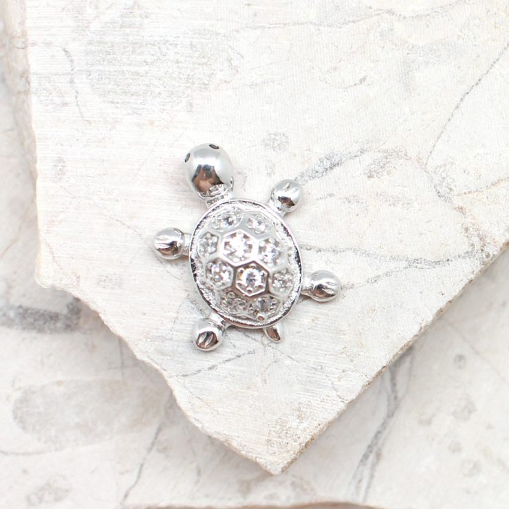 A photo of the The Tiny Turtle Pendant product