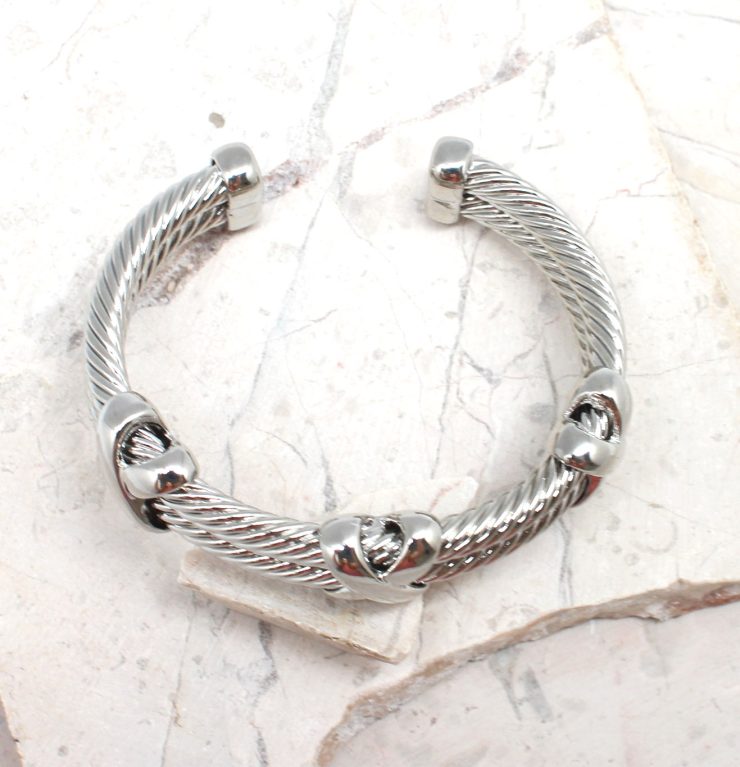 A photo of the Silver X Cuff Bracelet product