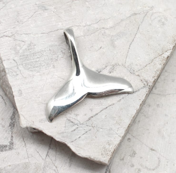 A photo of the The Whale Tail Pendant product