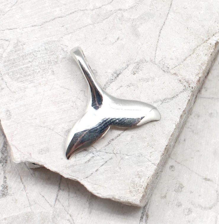 A photo of the The Whale Tail Pendant product
