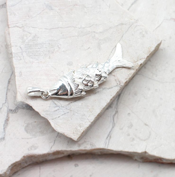 A photo of the The Fishing Pendant product