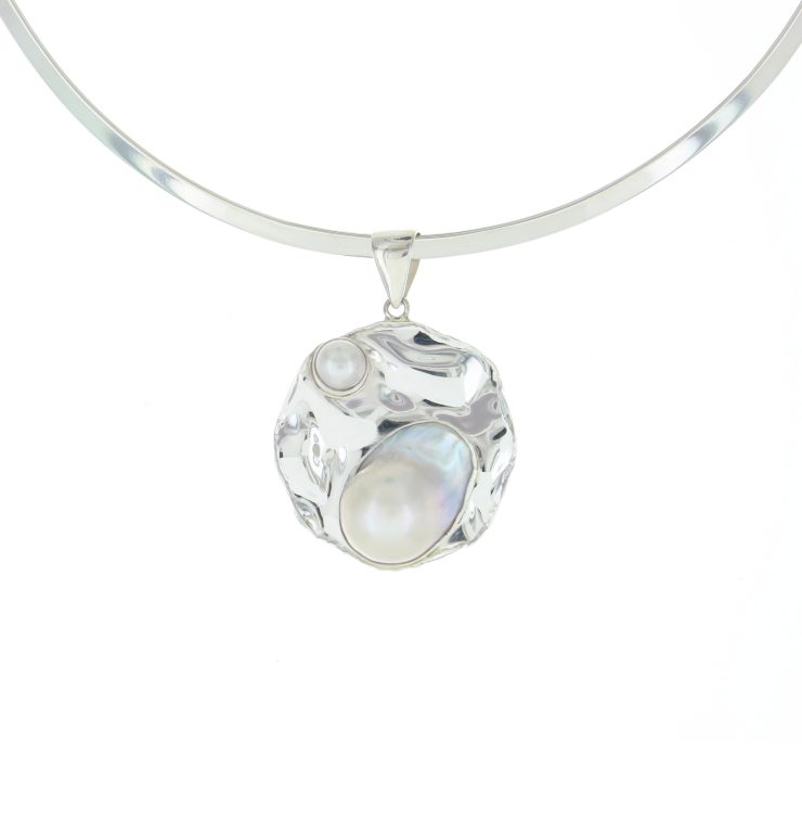 A photo of the Pearls In A Silver Sea Pendant product