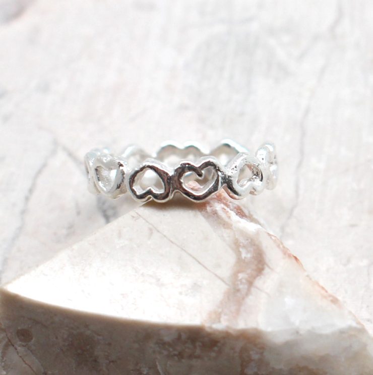 A photo of the The Hearts Over Hearts Toe Ring product