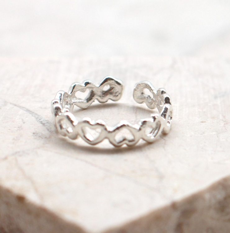A photo of the The Hearts Over Hearts Toe Ring product