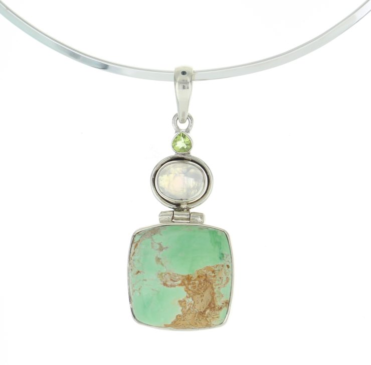 A photo of the Moon Stone and Green Turquoise Pendant product