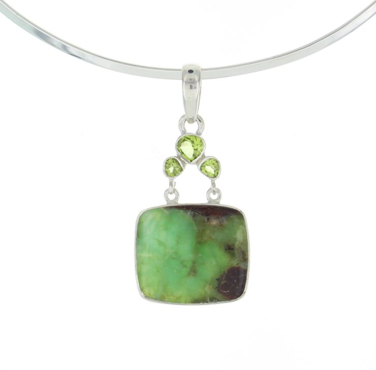 A photo of the Rain Forest Rhyolite Sterling Silver Pendant product