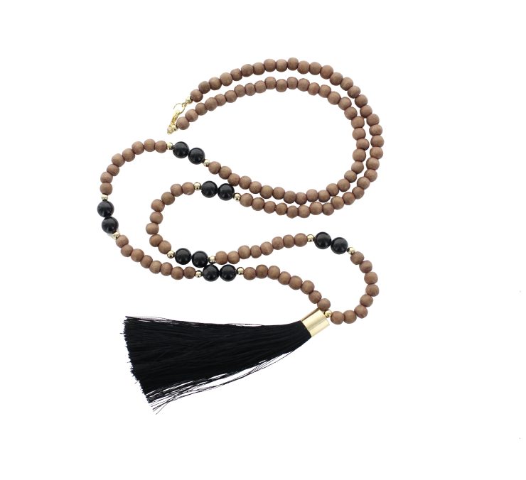 A photo of the Wood Beaded Black Tassel Necklace product
