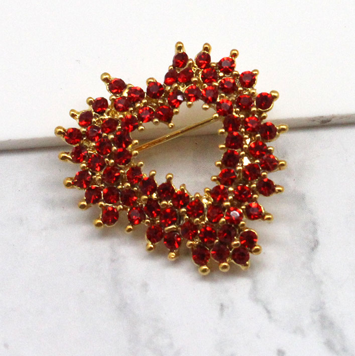 A photo of the Red Burst Heart Pin product