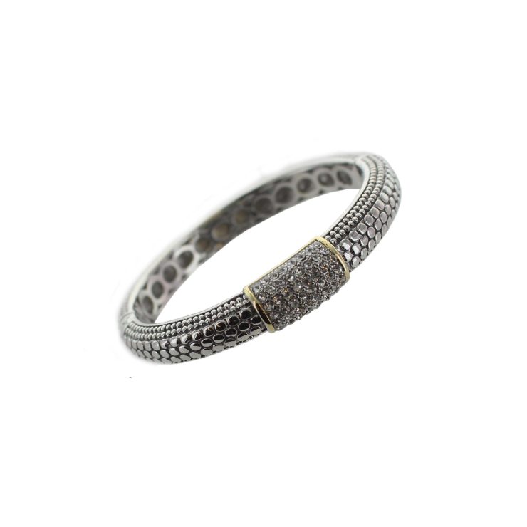 A photo of the Metal Dots Bangle product