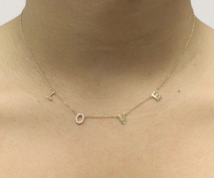 A photo of the Gold Plated "Love" Necklace product