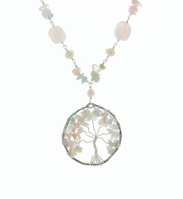 A photo of the Light Pink Tree Of  Life Necklace product