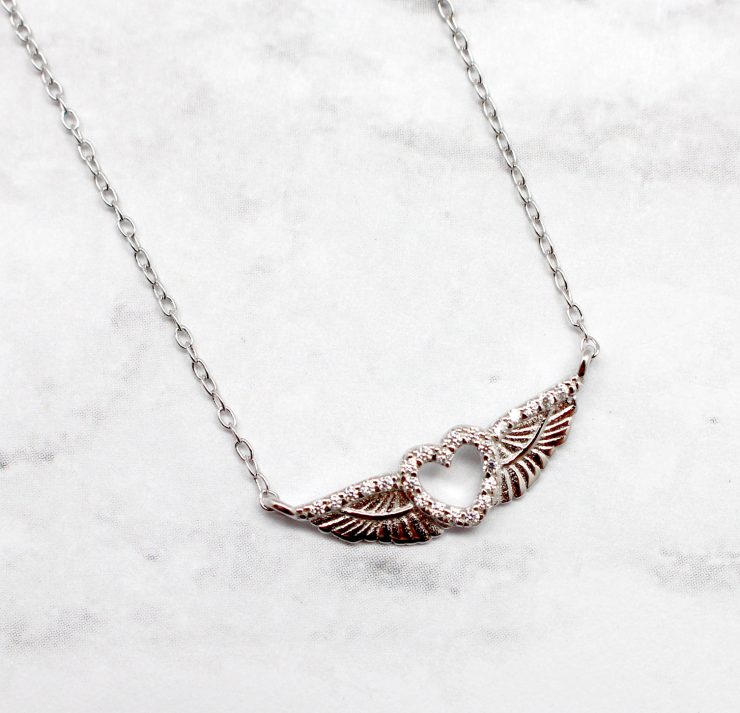 A photo of the On The Wings Of Love Necklace product