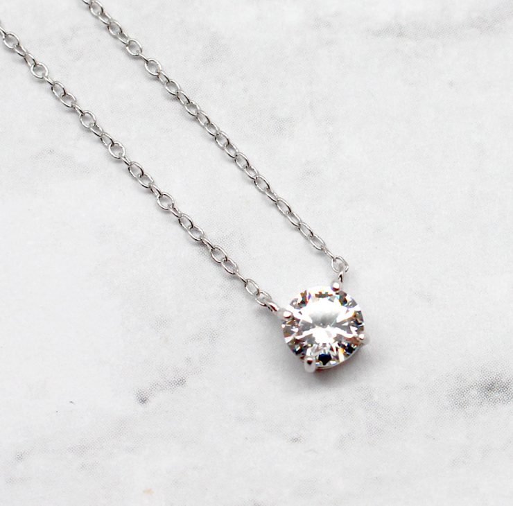 A photo of the Single Floating CZ Necklace product