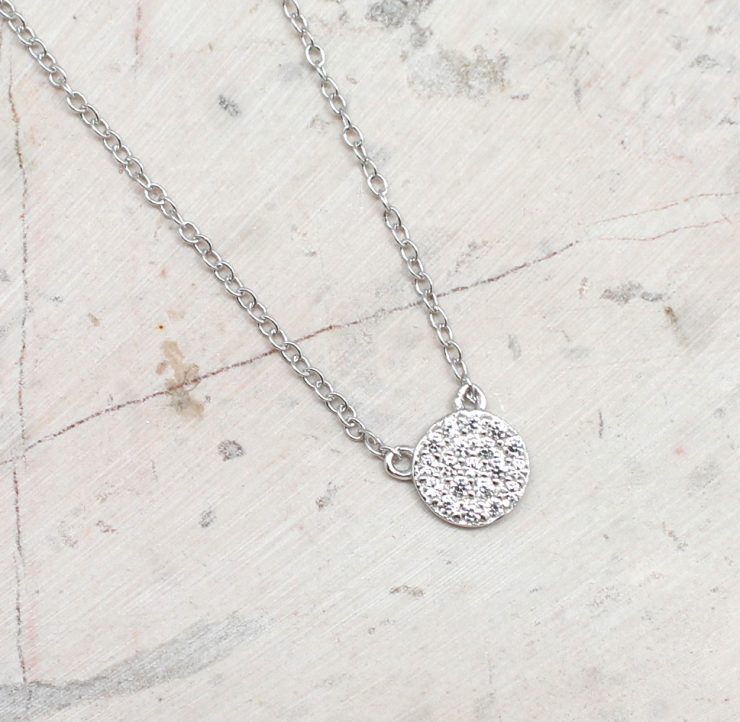 A photo of the Cubic Zirconia Pave Coin Necklace product