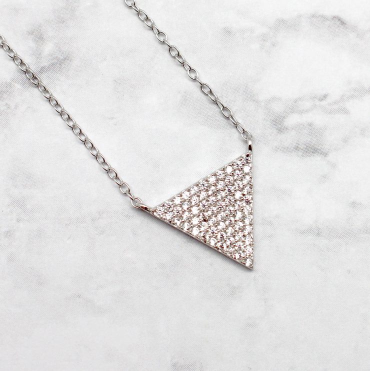 A photo of the Triangles and Troubles Necklace product
