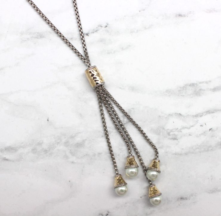 A photo of the Pearl Drops Necklace product