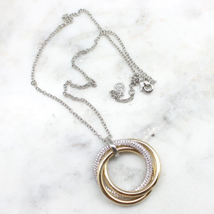 A photo of the Gold & Silver Pave Ring Necklace product