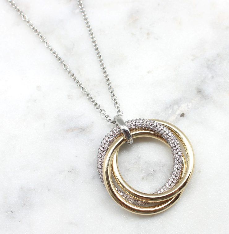 A photo of the Gold & Silver Pave Ring Necklace product