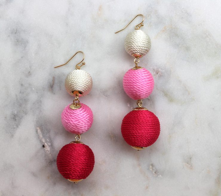 A photo of the Thread Ball Earrings product