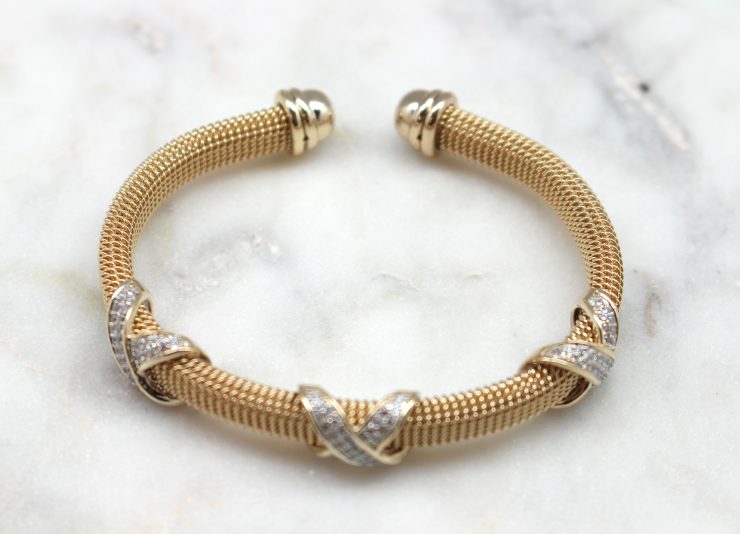 A photo of the Rhinestone X Cuff Bracelet product