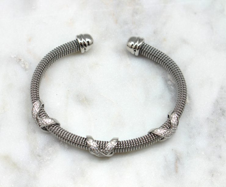 A photo of the Rhinestone X Cuff Bracelet product