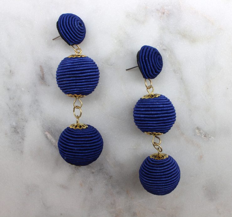 A photo of the Thread Wrap Ball Earrings product