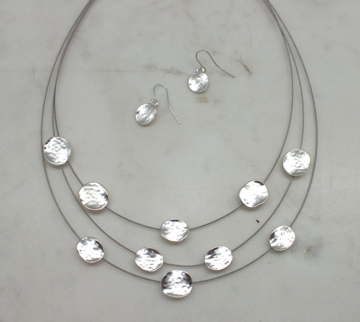 A photo of the Disc-o All Night Necklace product