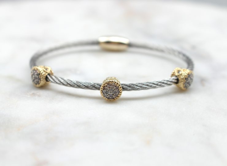 A photo of the Magnetic Two Tone Cable Bangle product