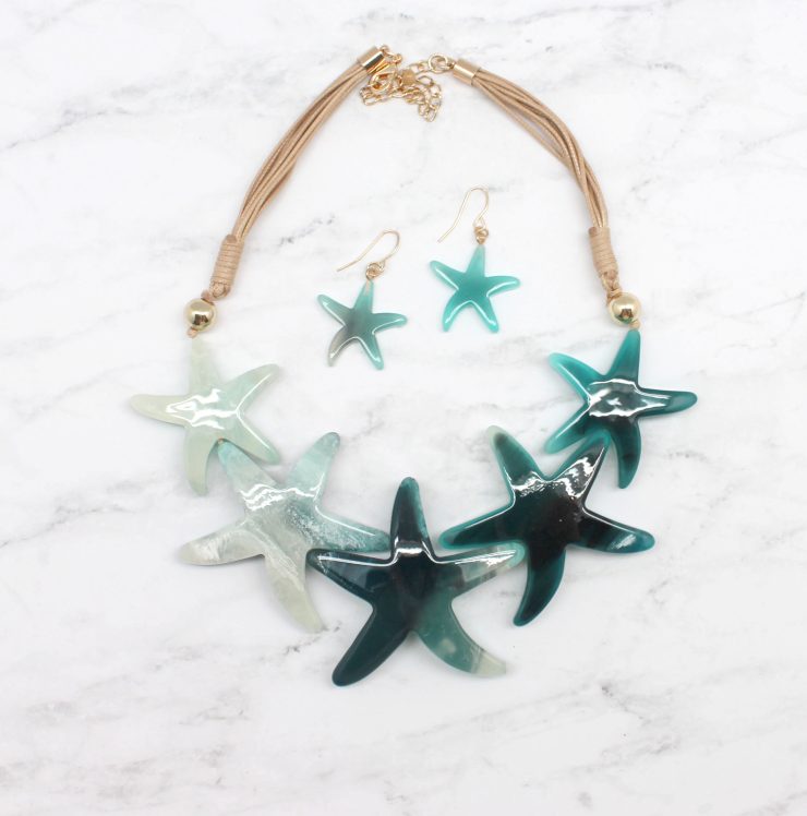 A photo of the Multi Starfish Cord Statement Necklace product