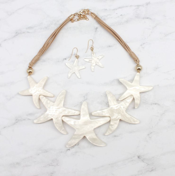 A photo of the Multi Starfish Cord Statement Necklace product