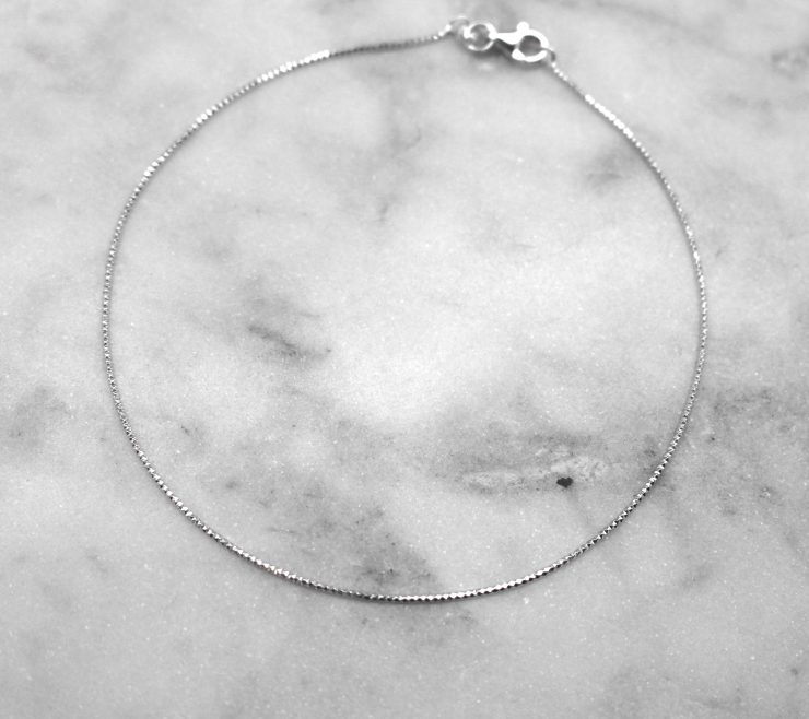A photo of the Simple Statement Anklet product