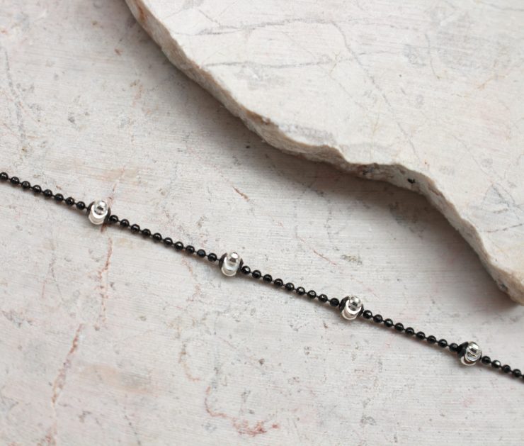 A photo of the Black and Silver Bracelet product