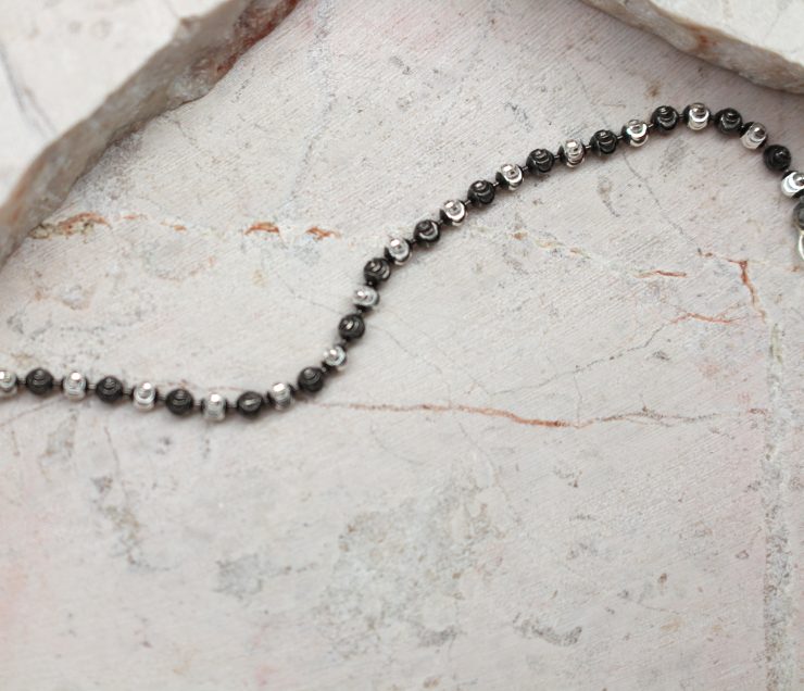 A photo of the Black and Silver Beaded Bracelet product