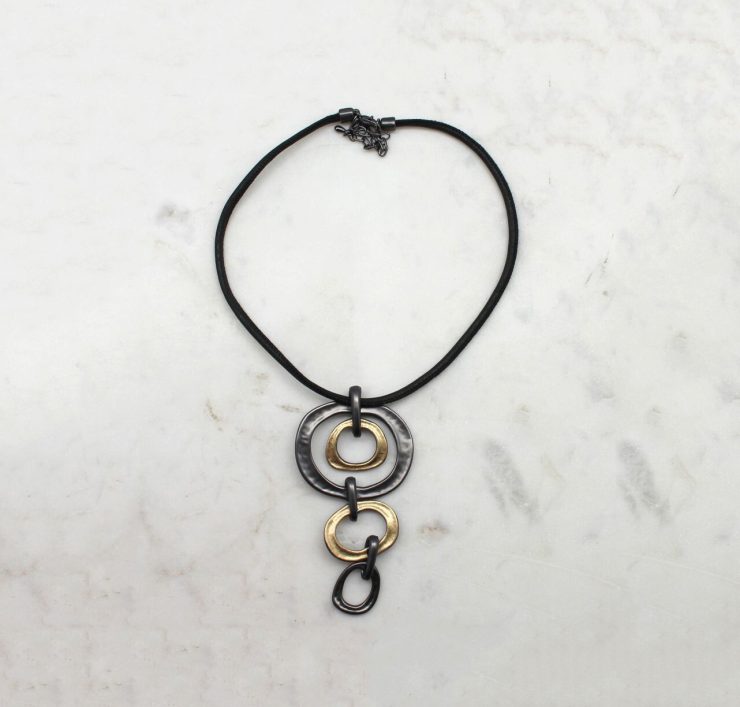 A photo of the Falling Freely Cord Necklace product