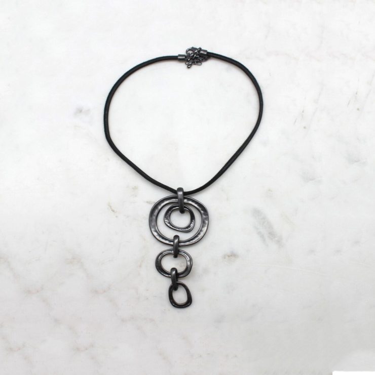 A photo of the Falling Freely Cord Necklace product