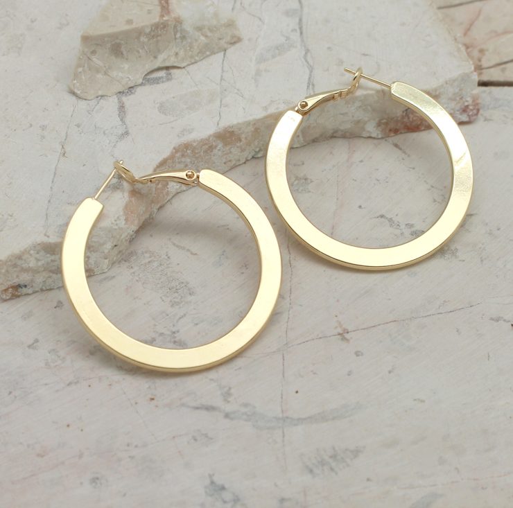 A photo of the Luxurious Look Hoop Earrings product